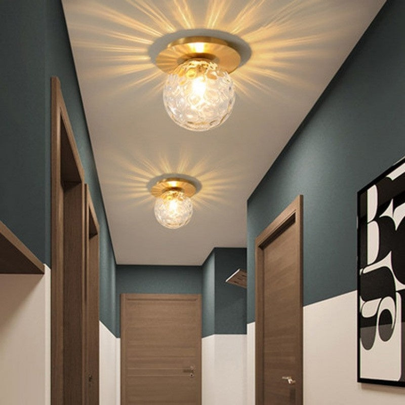 Frosted glass sphere wall light with brushed metal circular backplate