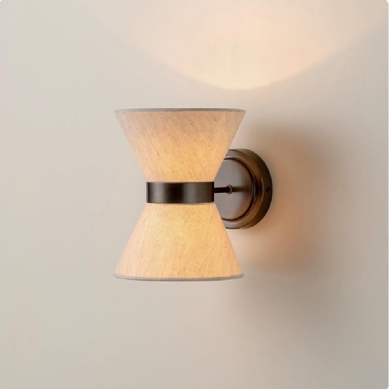 Wall-mounted lamp with warm ambient glow, suitable for bedroom or living room use