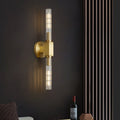 Clear glass wall sconce with minimalist design, suitable for bedroom use