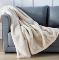 Warm beige chinchilla faux fur throw draped over a sofa or chair