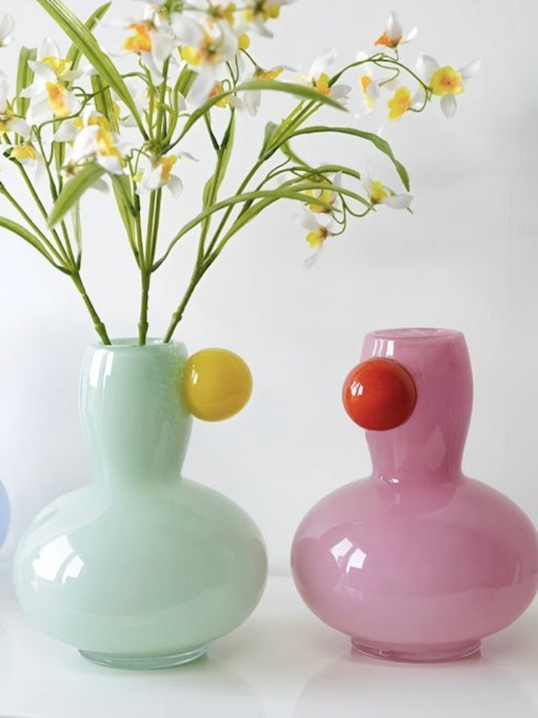 Handblown clear glass bud vase with spherical bubble base and narrow neck